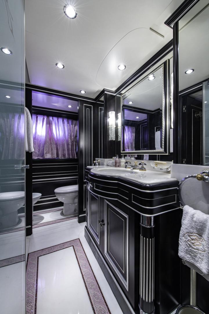 a bathroom with a large mirror aboard RUTLI E Yacht for Sale