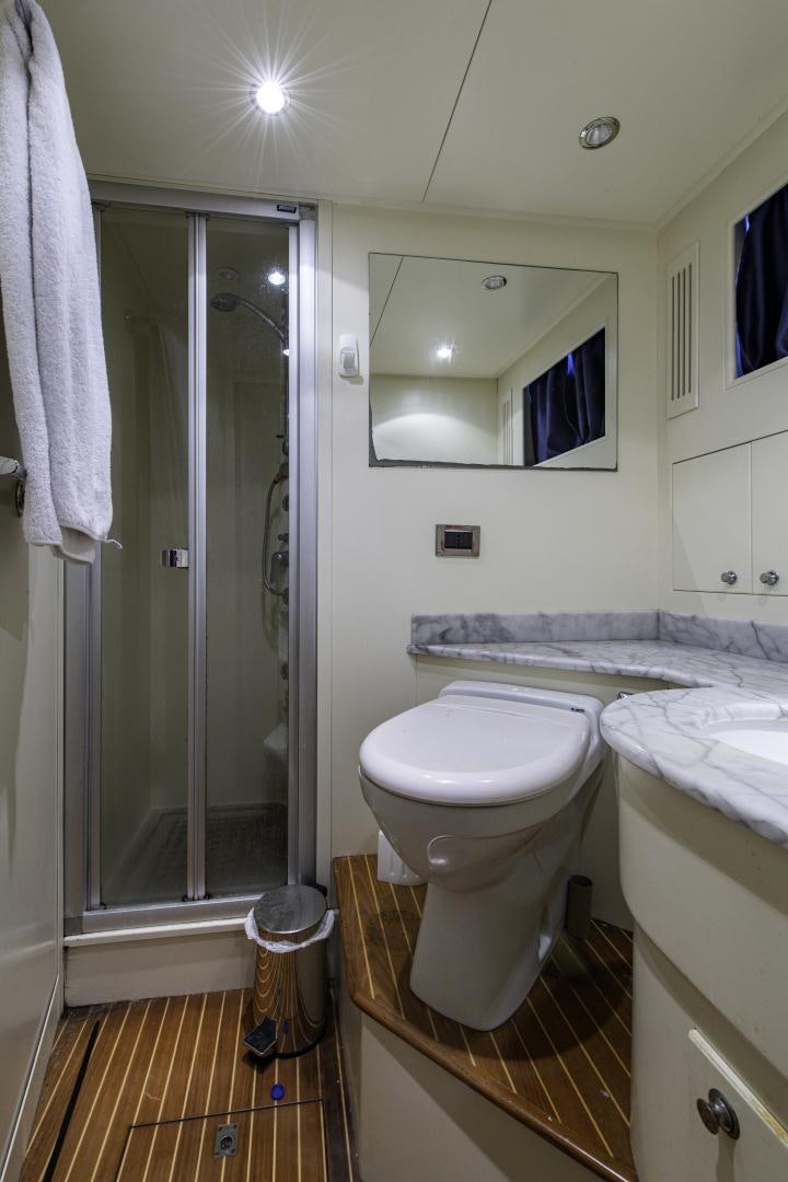 a bathroom with a glass shower aboard RUTLI E Yacht for Sale