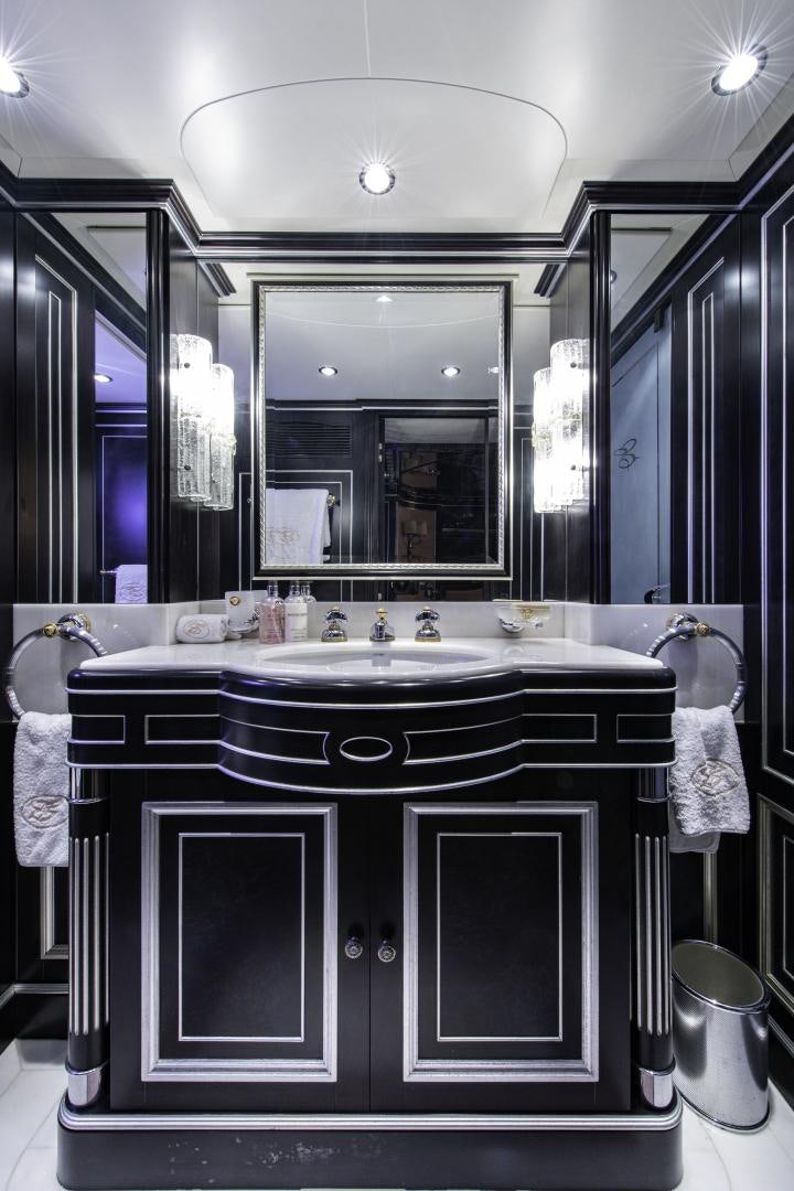 a bathroom with a large mirror aboard RUTLI E Yacht for Sale
