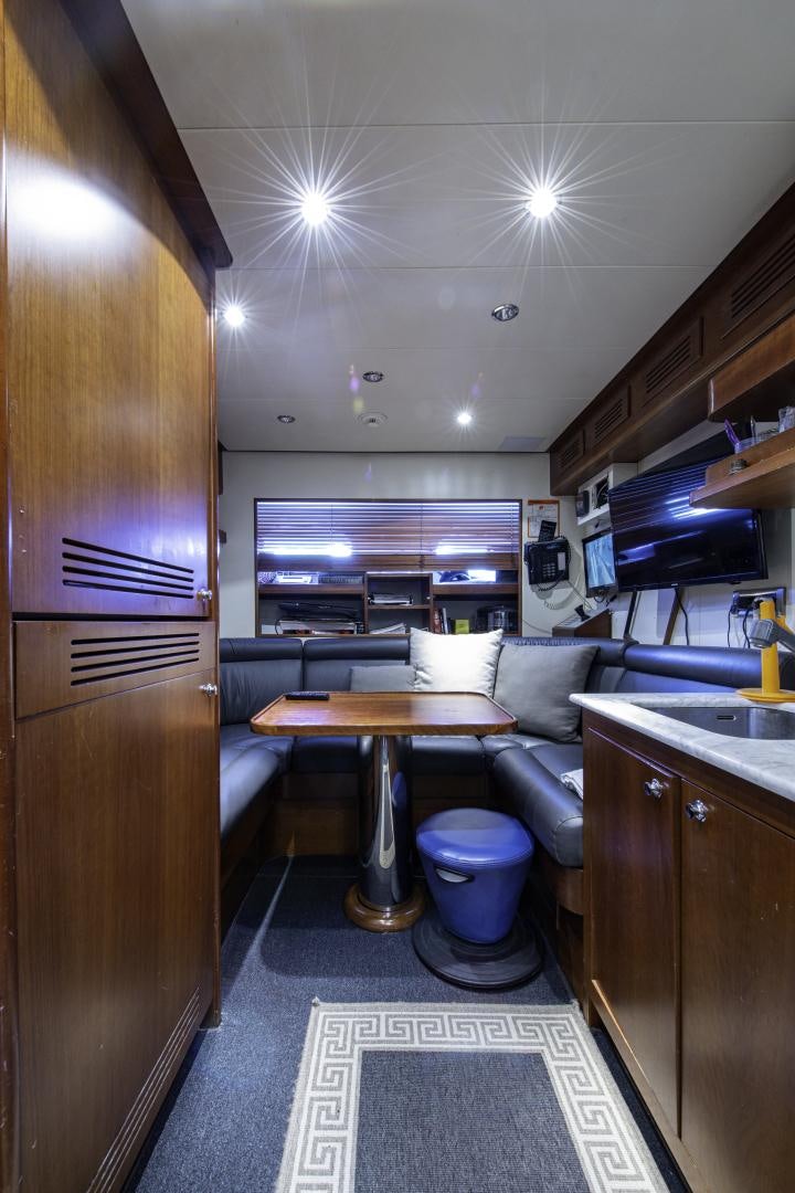 a kitchen with a bar and a bar aboard RUTLI E Yacht for Sale