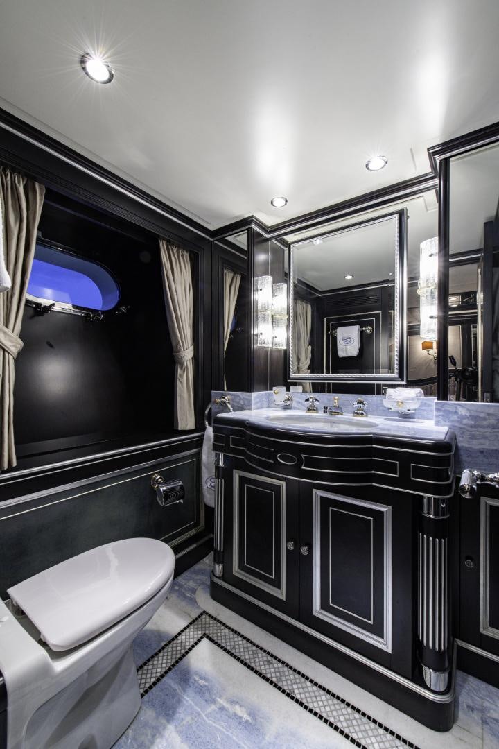 a bathroom with a large mirror aboard RUTLI E Yacht for Sale