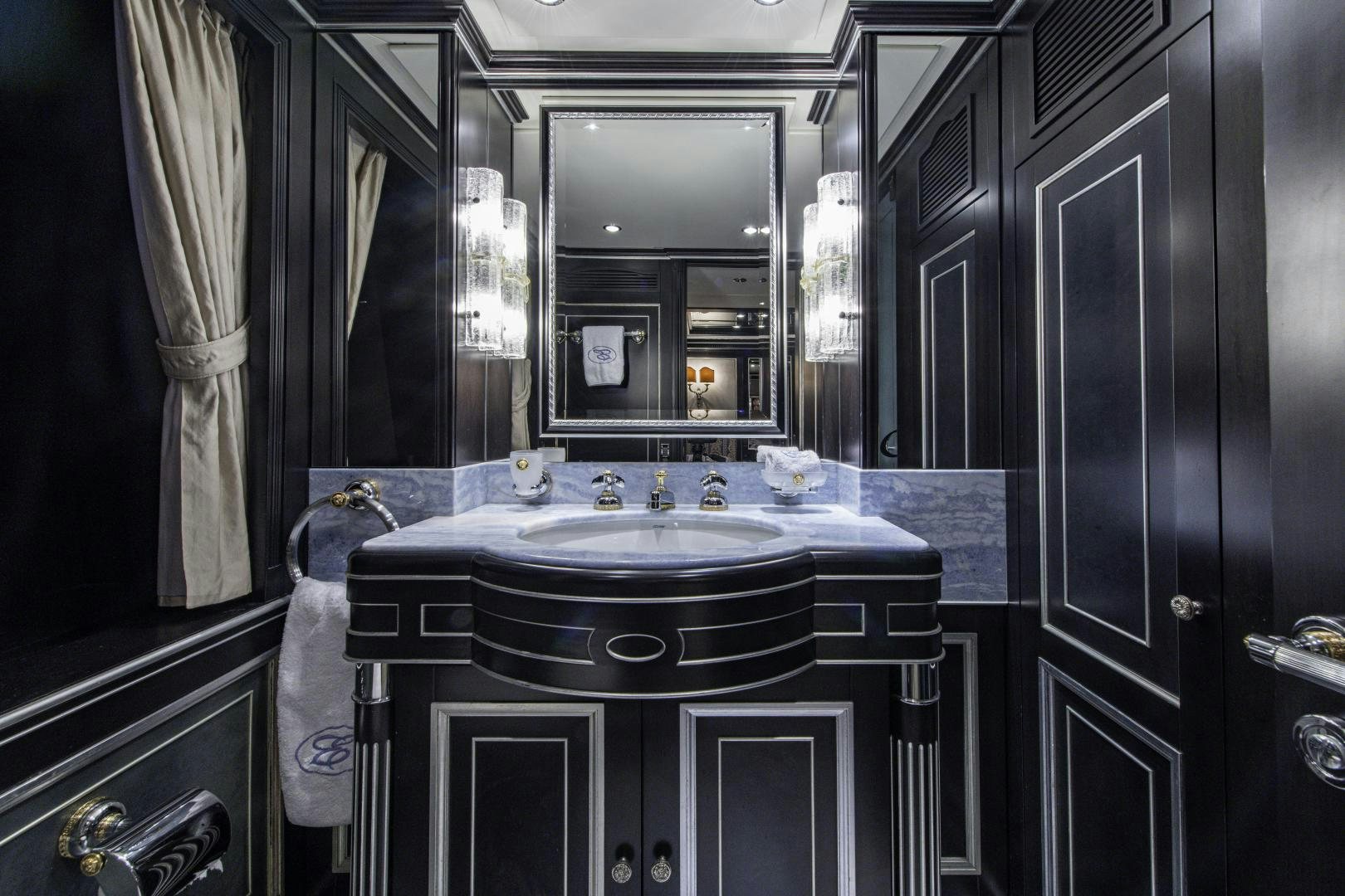 a bathroom with a sink and a mirror aboard RUTLI E Yacht for Sale