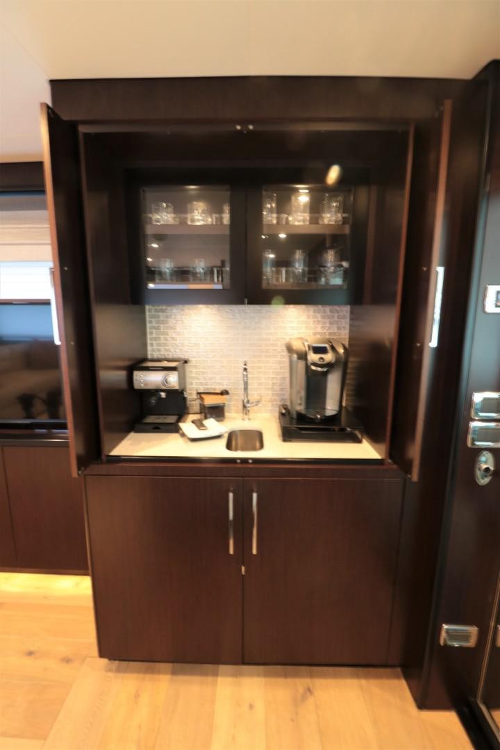 a kitchen with a microwave oven and cabinets aboard LADY CARMEN Yacht for Sale