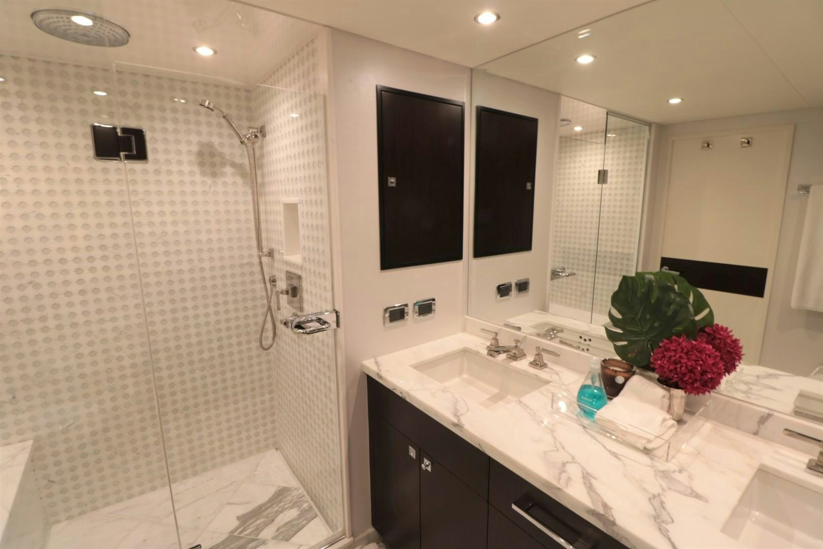 a bathroom with a large mirror aboard LADY CARMEN Yacht for Sale