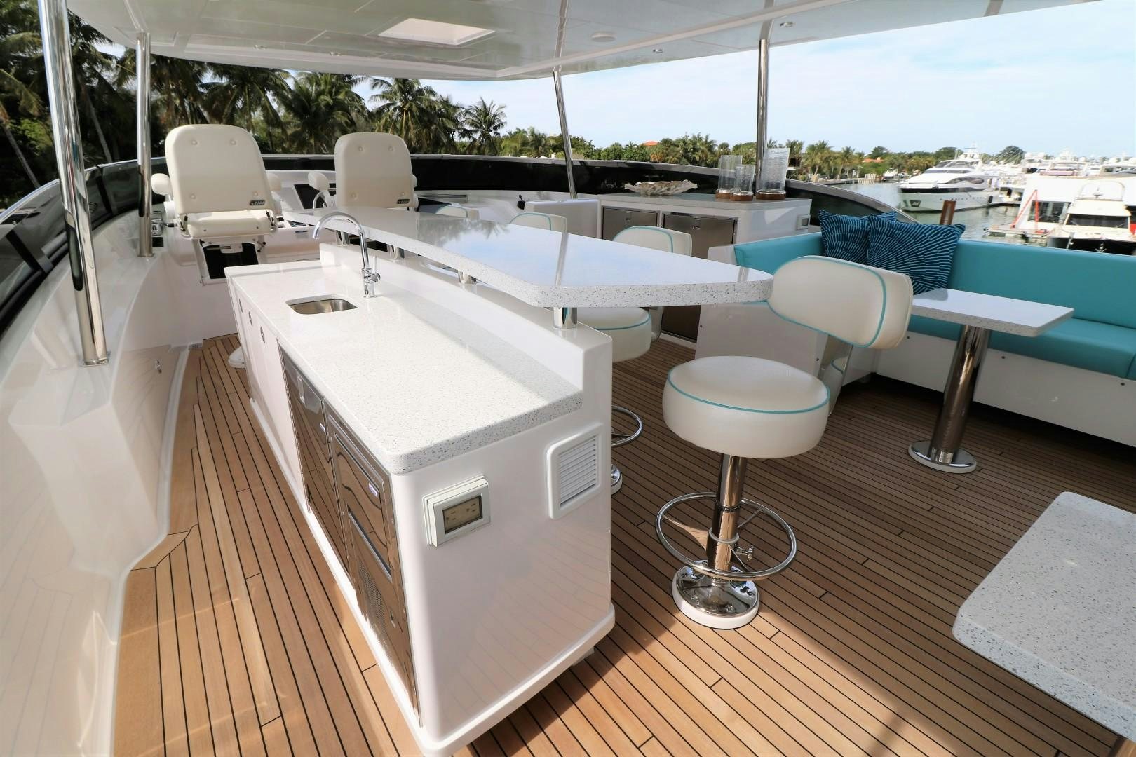 a room with a table chairs and a pool aboard LADY CARMEN Yacht for Sale