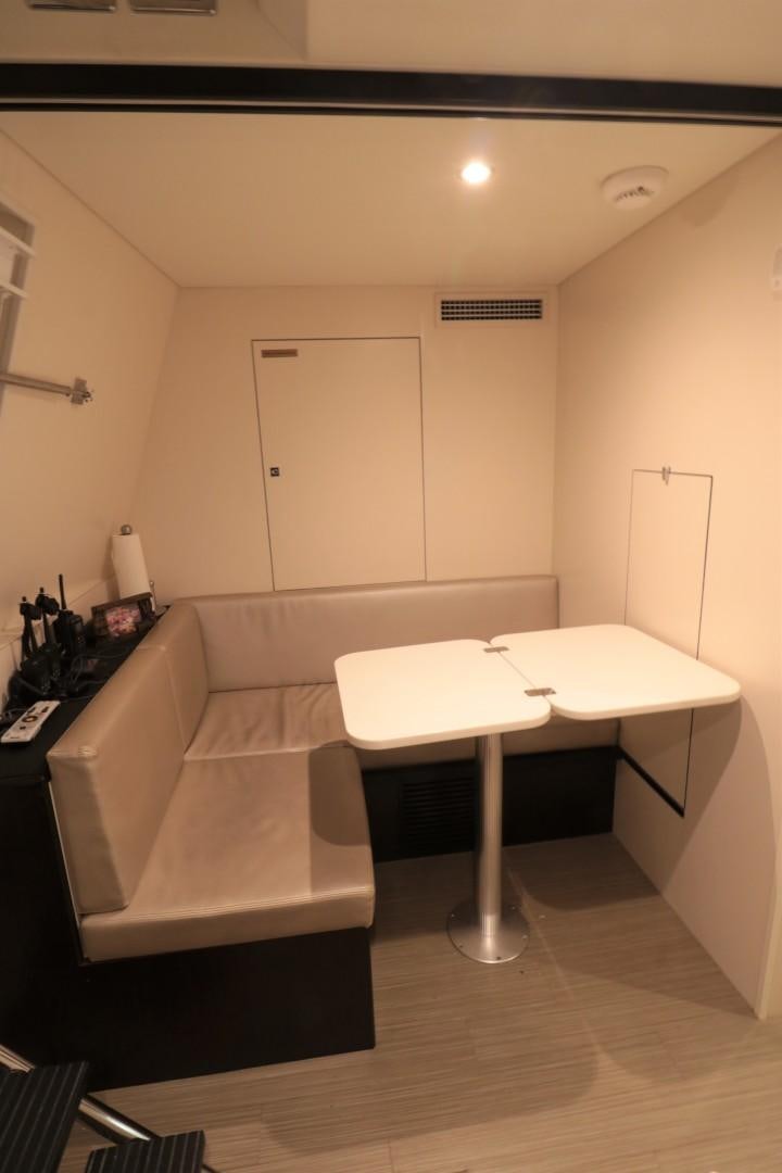 a room with a couch and a table aboard LADY CARMEN Yacht for Sale