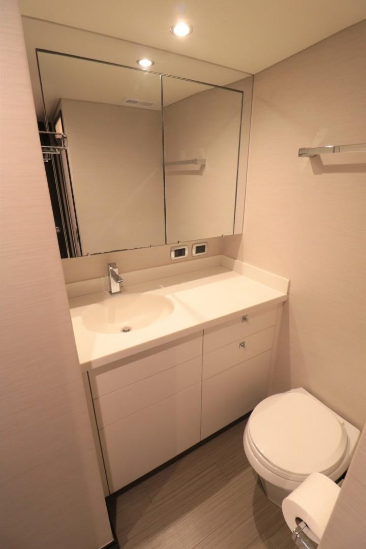a bathroom with a toilet and a sink aboard LADY CARMEN Yacht for Sale