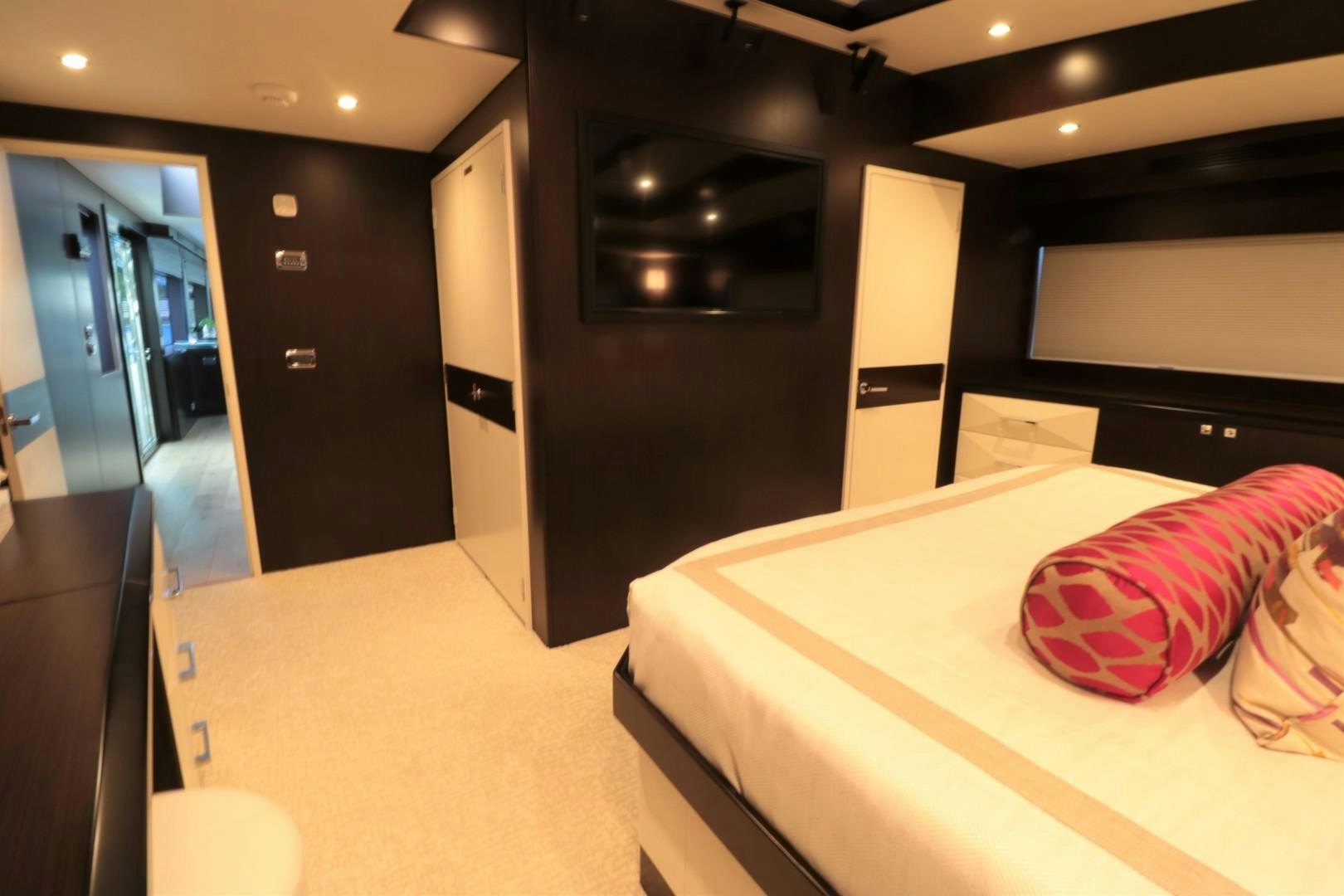 a room with a bed and a mirror aboard LADY CARMEN Yacht for Sale