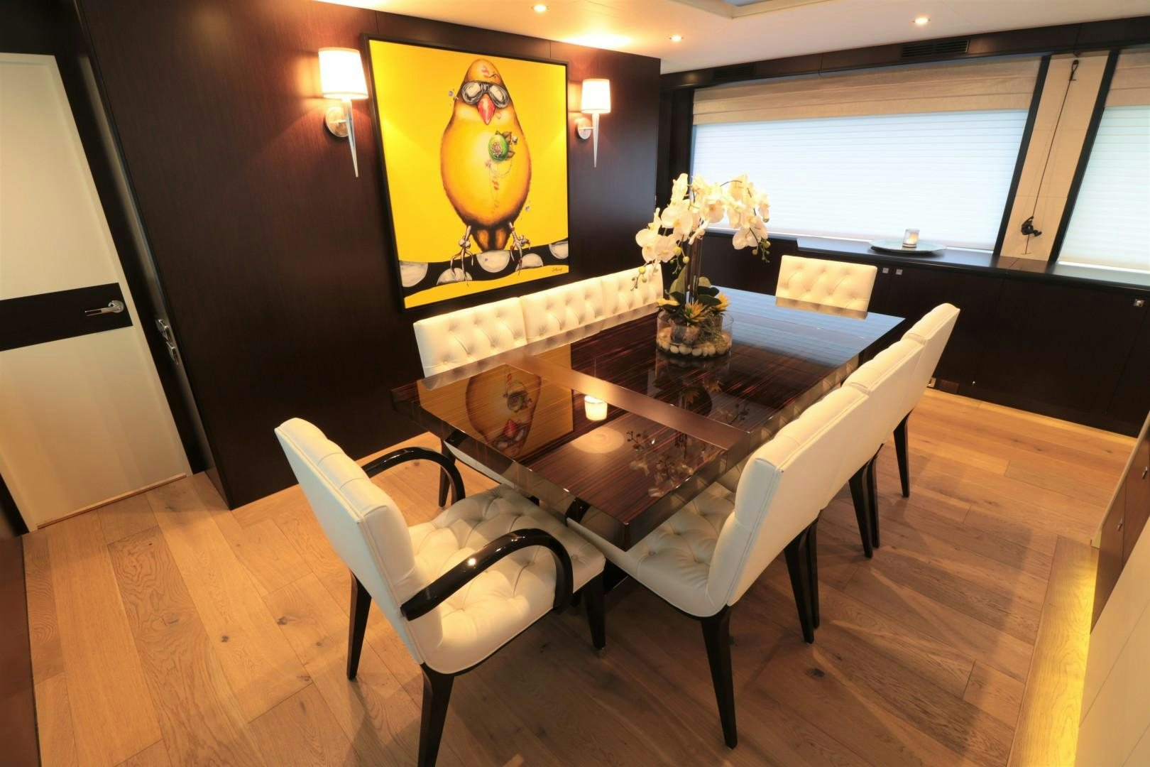 a dining table in a room aboard LADY CARMEN Yacht for Sale