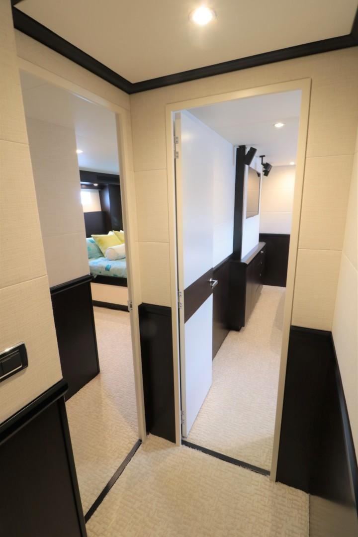 a hallway with a bed and a mirror aboard LADY CARMEN Yacht for Sale