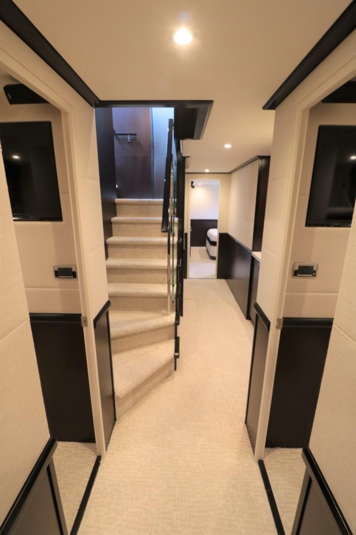 a hallway with a door and a carpet aboard LADY CARMEN Yacht for Sale