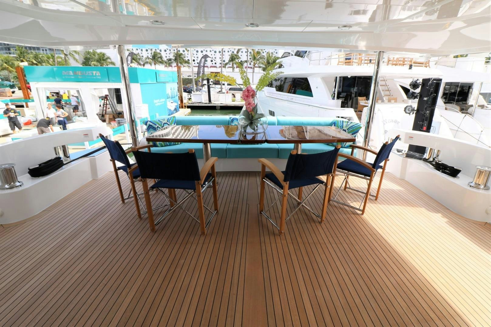 a table and chairs in a room aboard LADY CARMEN Yacht for Sale