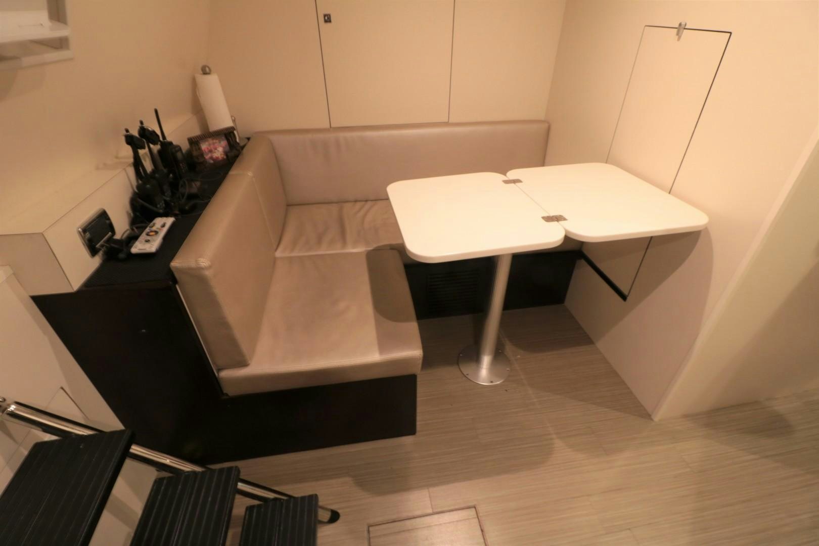 a couch and a table in a room aboard LADY CARMEN Yacht for Sale