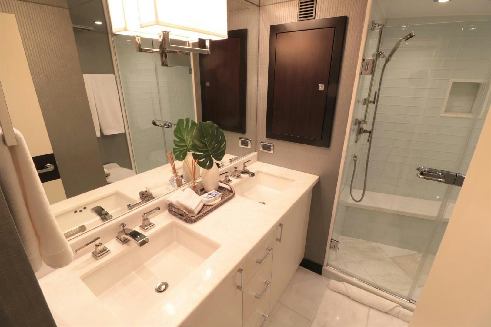 a bathroom with a glass shower aboard LADY CARMEN Yacht for Sale
