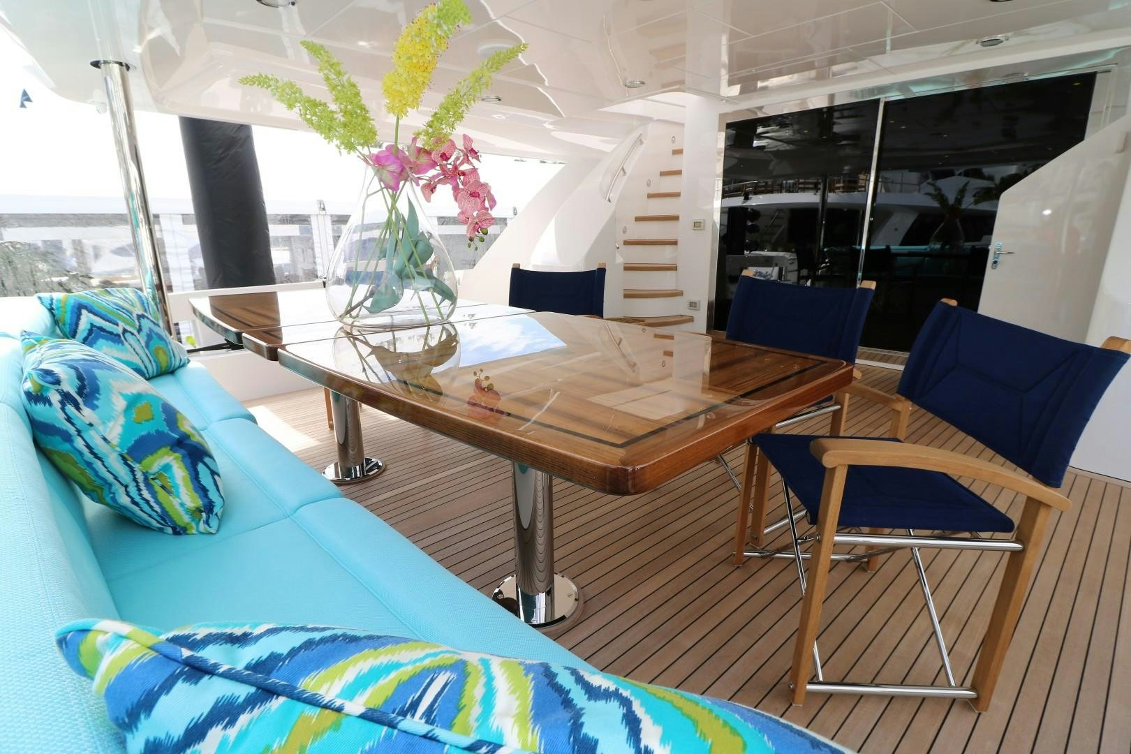 a room with a table and chairs aboard LADY CARMEN Yacht for Sale