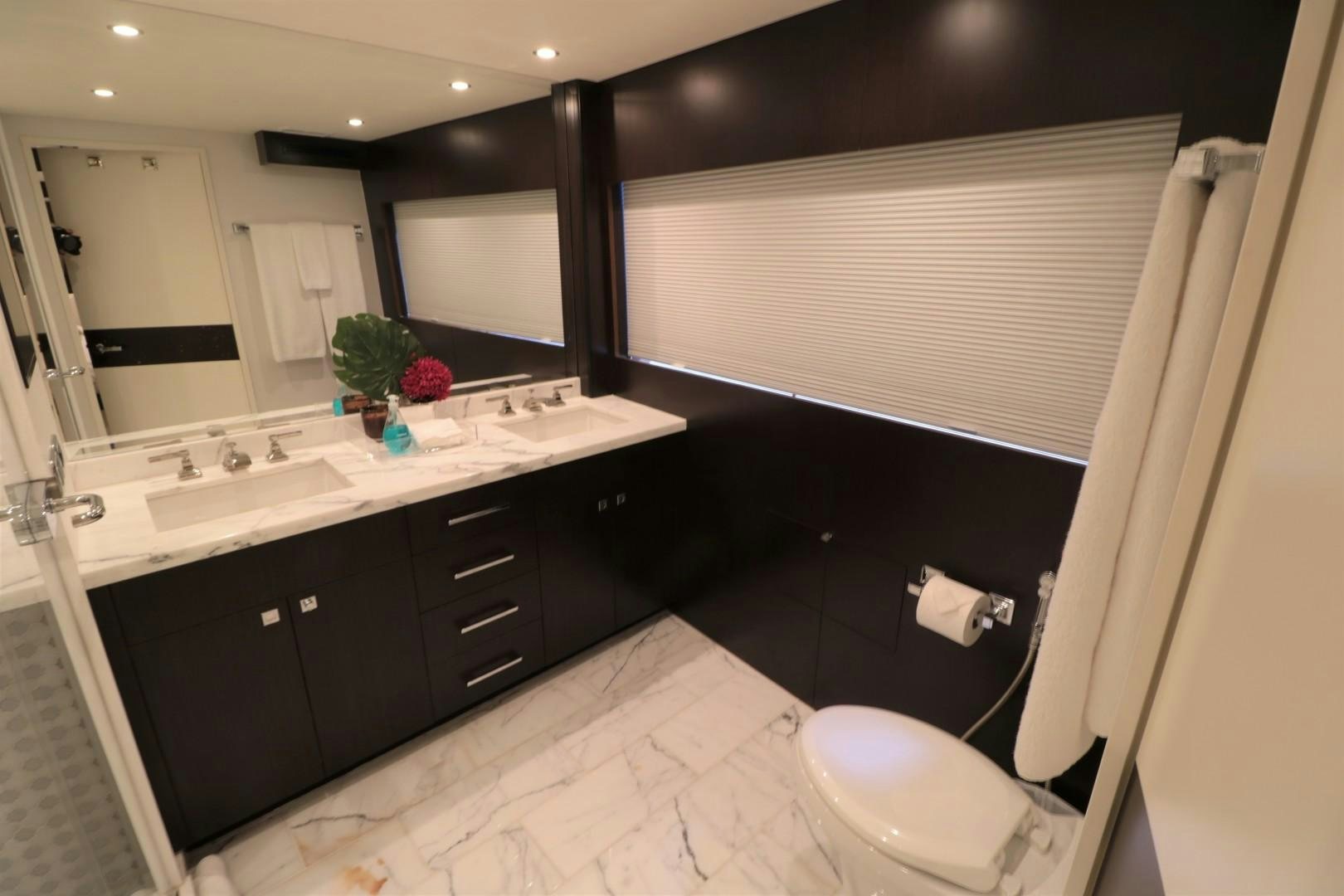 a bathroom with a large mirror aboard LADY CARMEN Yacht for Sale