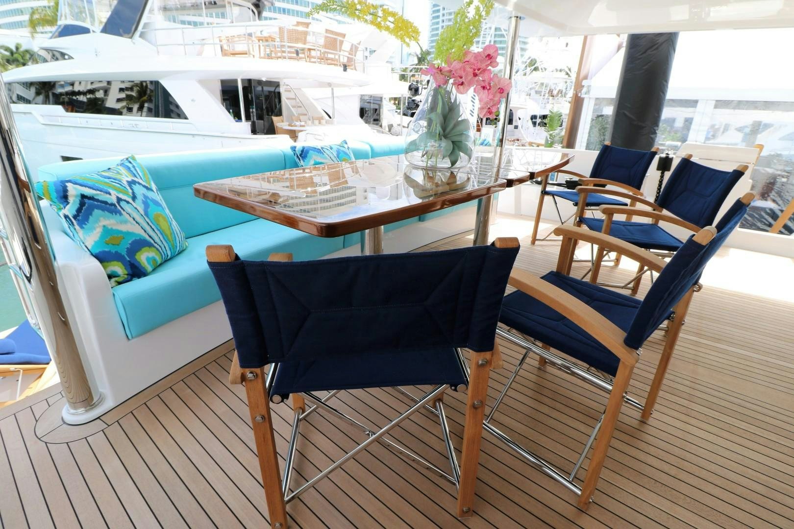 a table and chairs on a deck aboard LADY CARMEN Yacht for Sale