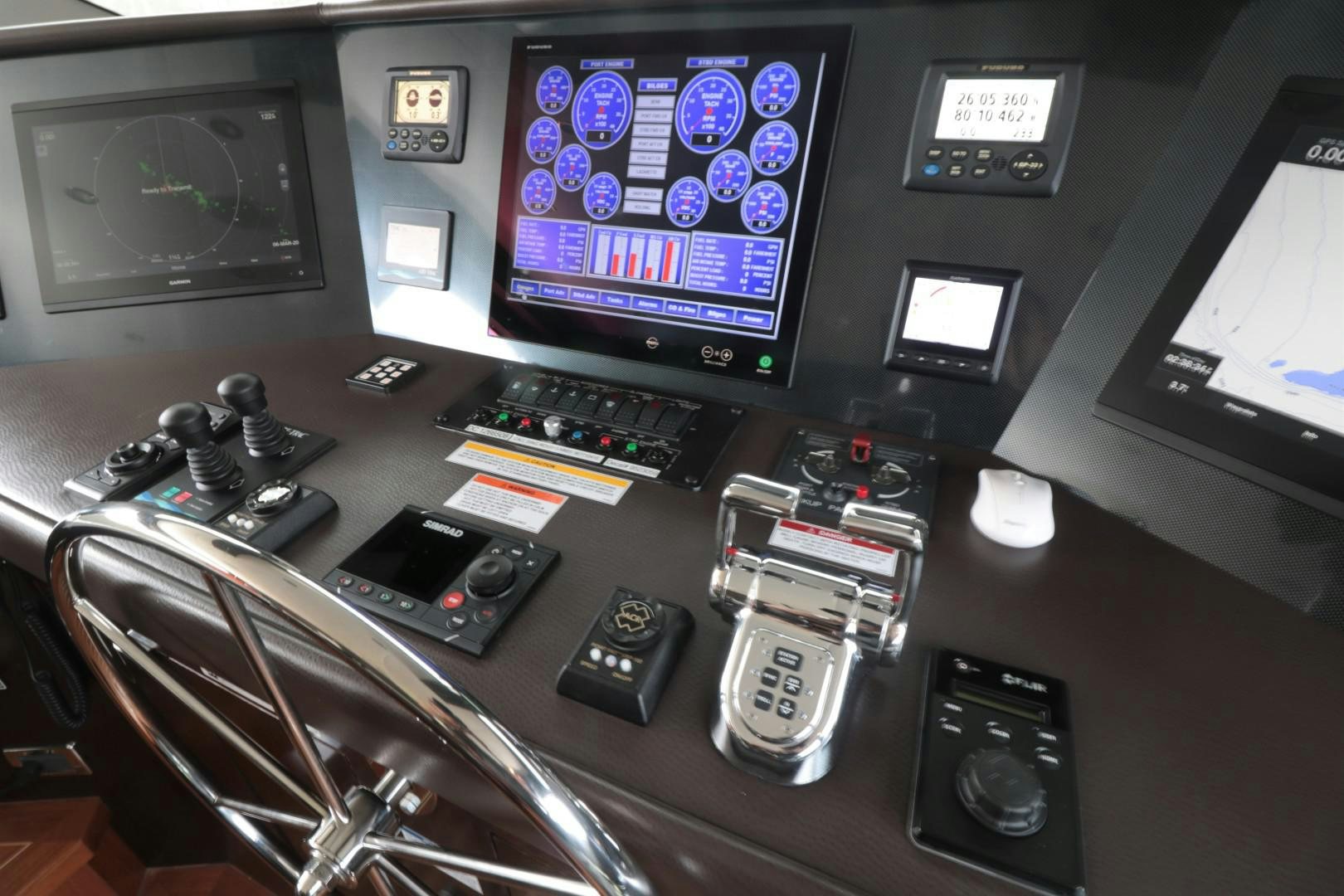 a control panel with a screen and other electronic devices aboard LADY CARMEN Yacht for Sale