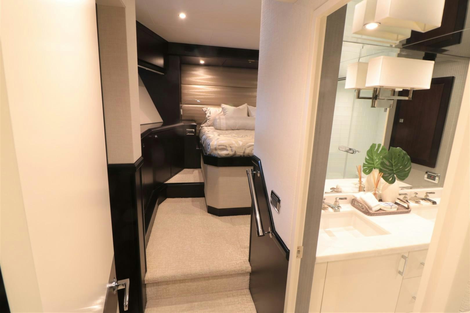 a room with a bed and a desk aboard LADY CARMEN Yacht for Sale