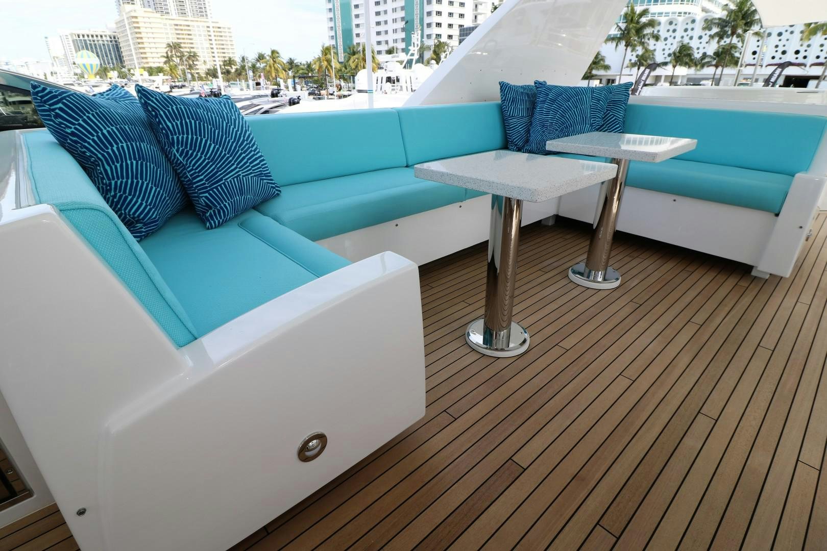 a deck with a table and chairs aboard LADY CARMEN Yacht for Sale