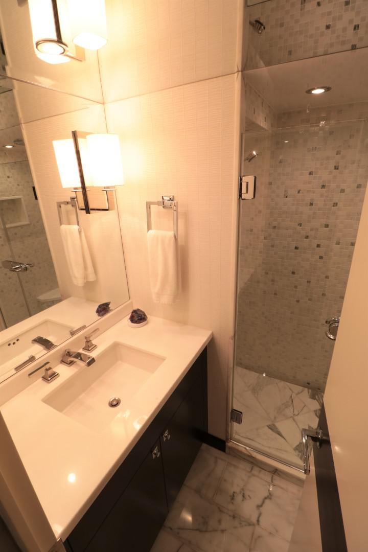 a bathroom with a sink and shower aboard LADY CARMEN Yacht for Sale