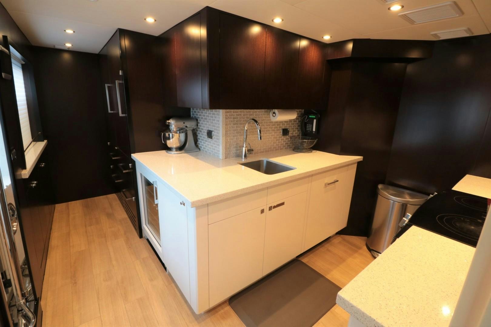 a kitchen with a large island aboard LADY CARMEN Yacht for Sale