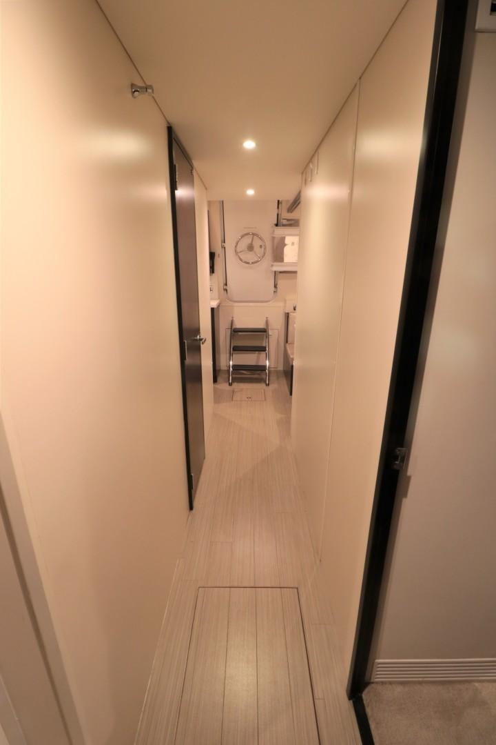 a hallway with a clock aboard LADY CARMEN Yacht for Sale