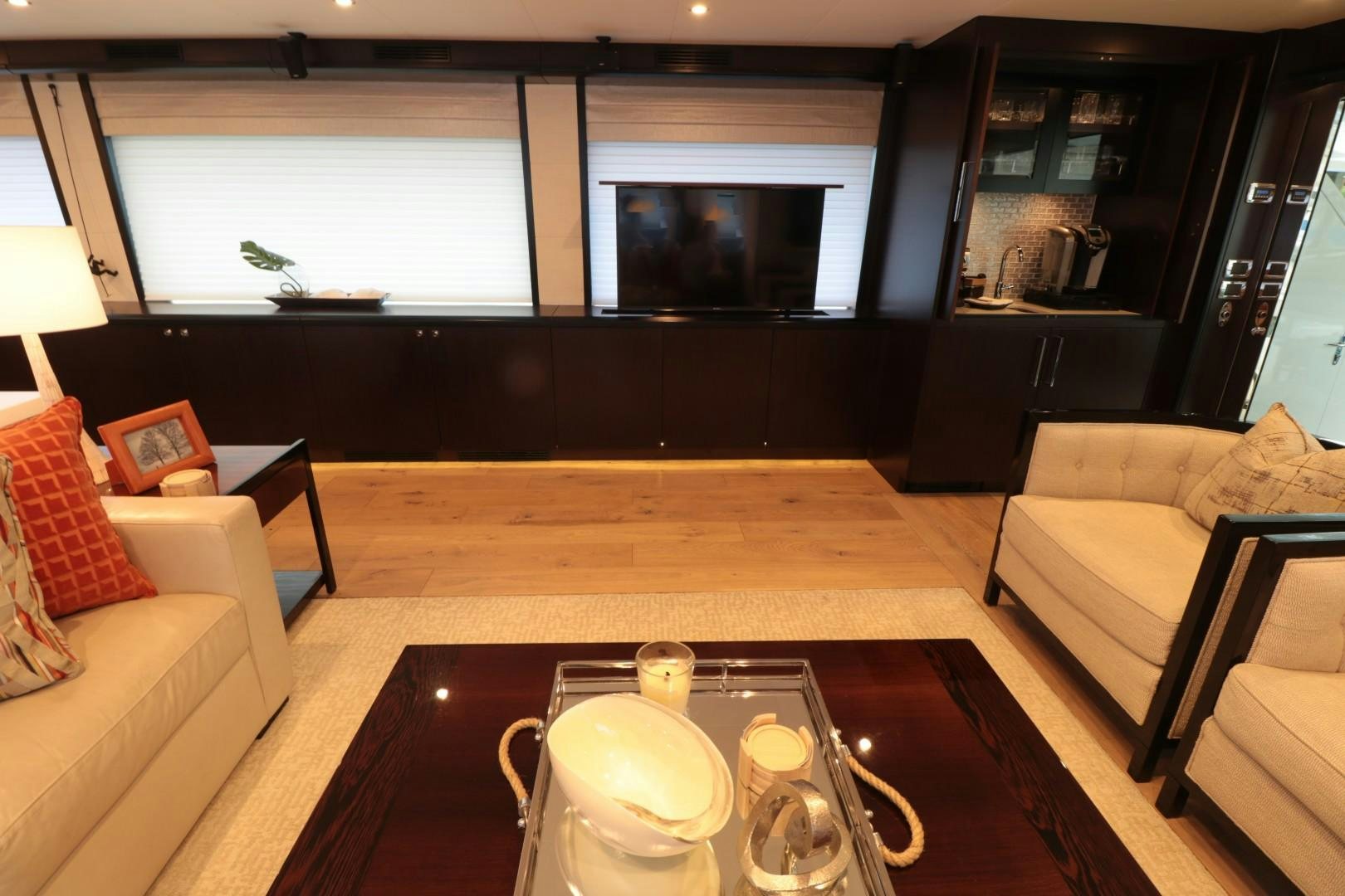 a living room with a table and chairs aboard LADY CARMEN Yacht for Sale