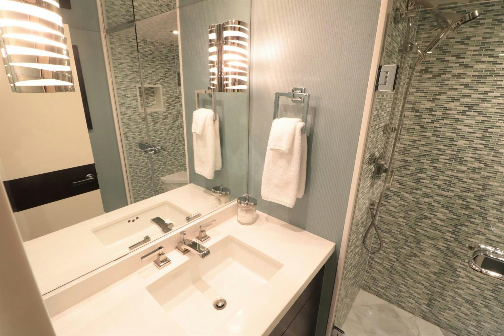 a bathroom with a sink and a shower curtain aboard LADY CARMEN Yacht for Sale