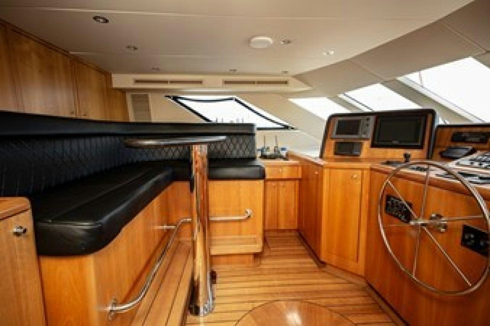 a room with a piano and a wood floor aboard TAIMA Yacht for Sale