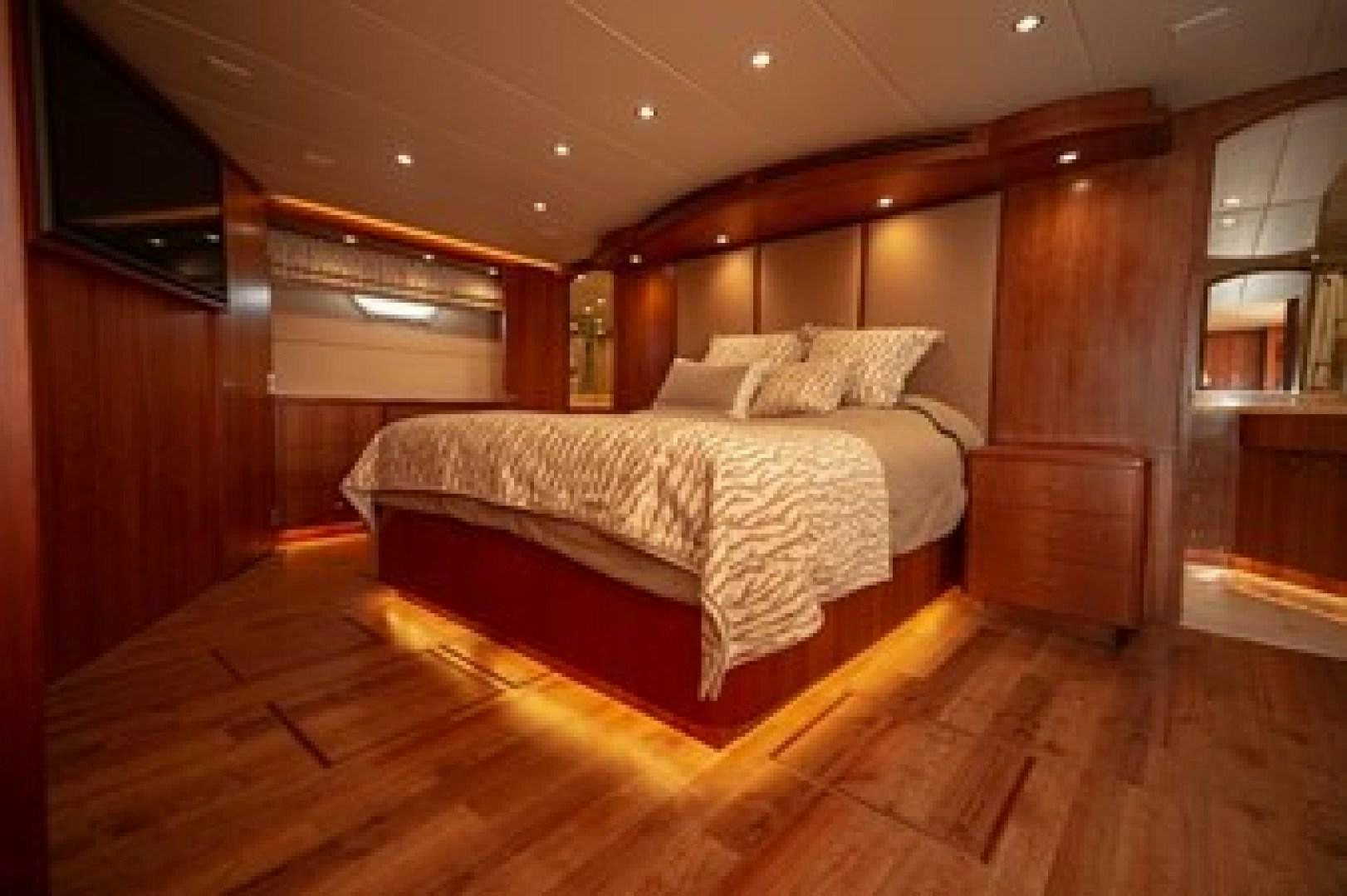 a bed in a room aboard TAIMA Yacht for Sale