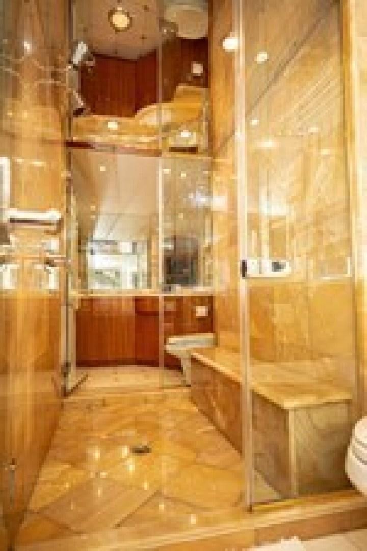 a room with a glass wall aboard TAIMA Yacht for Sale