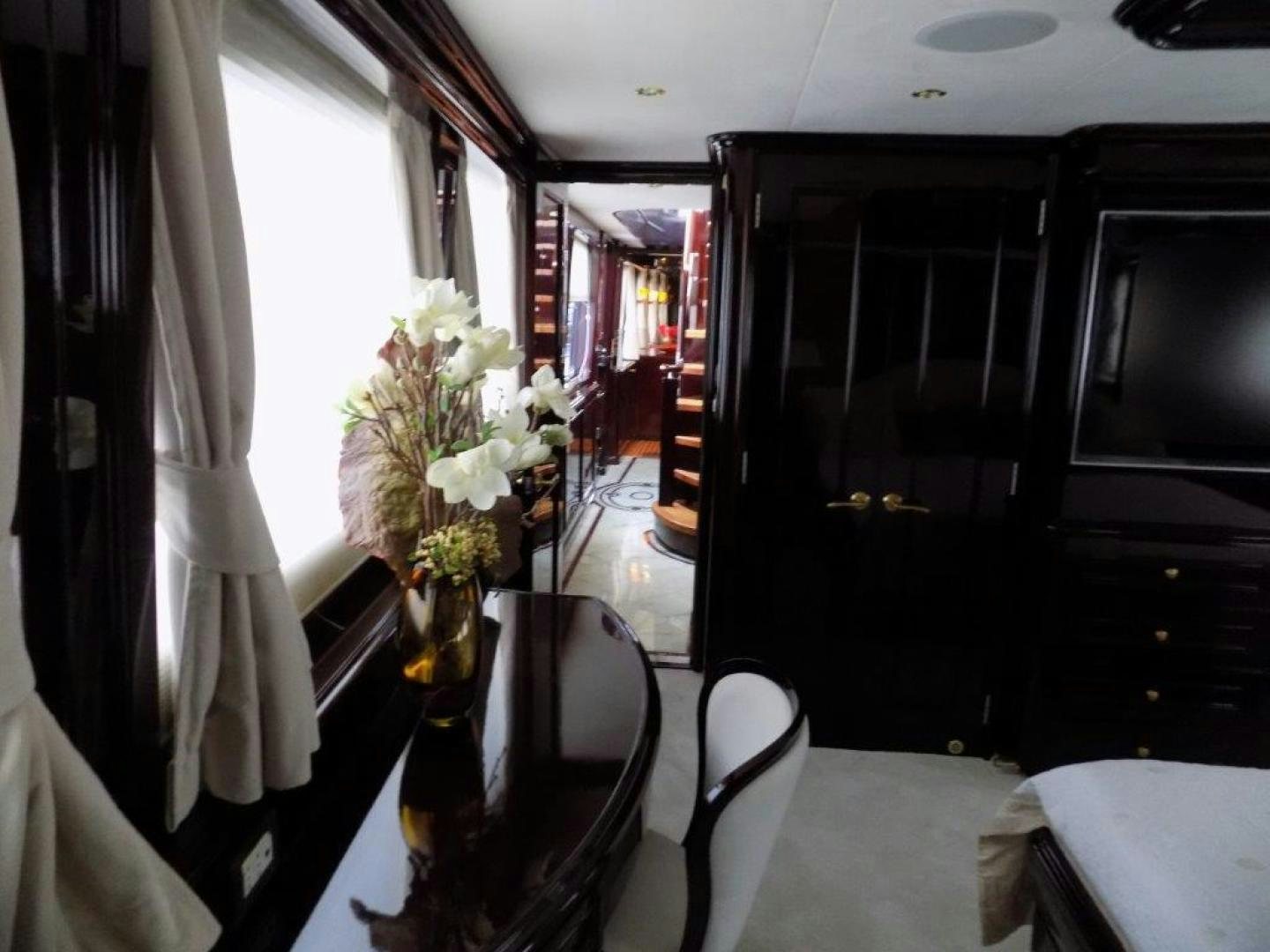 a vase of flowers on a table aboard BENDIS Yacht for Sale