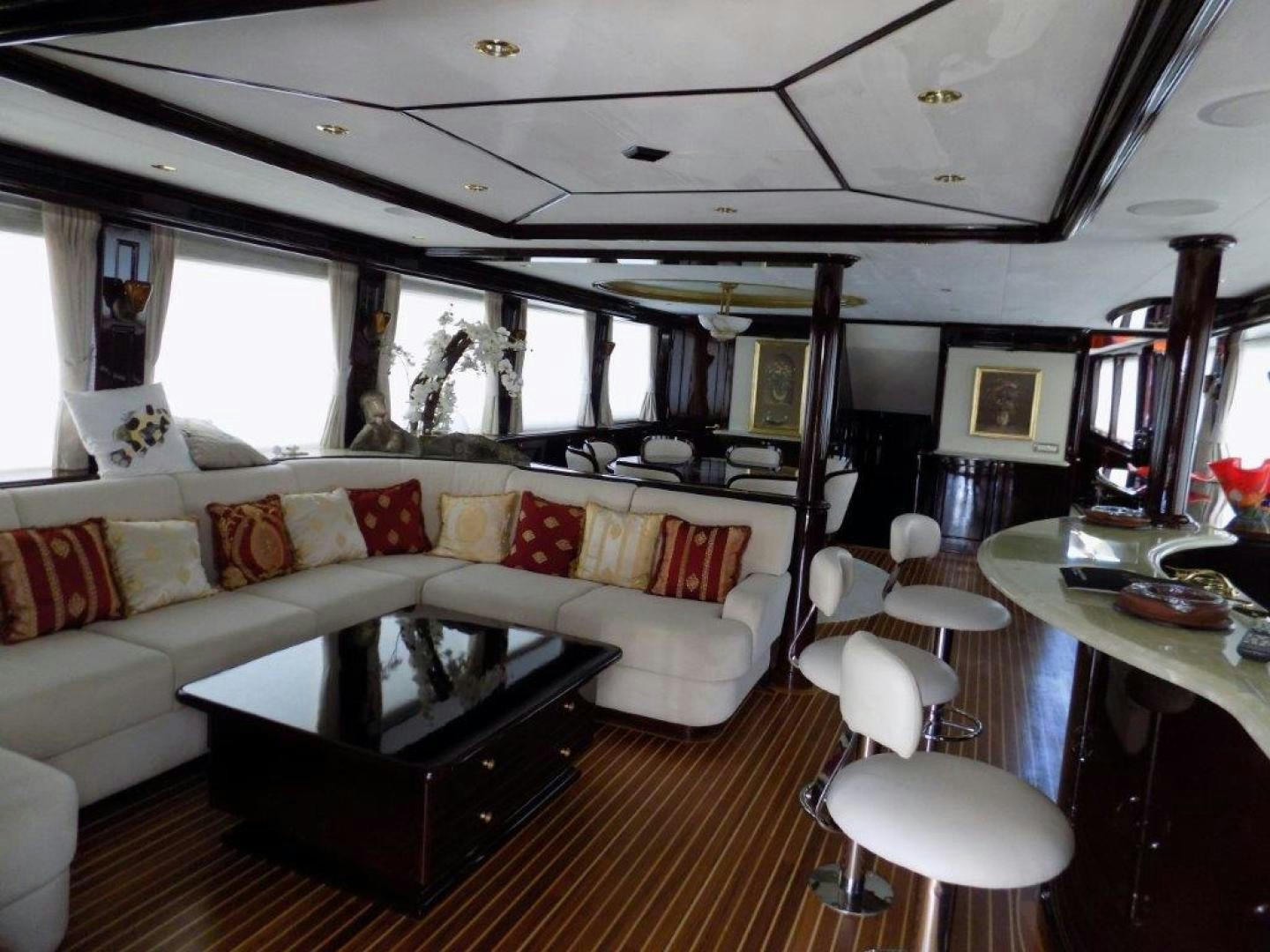 a living room with a couch and a coffee table aboard BENDIS Yacht for Sale