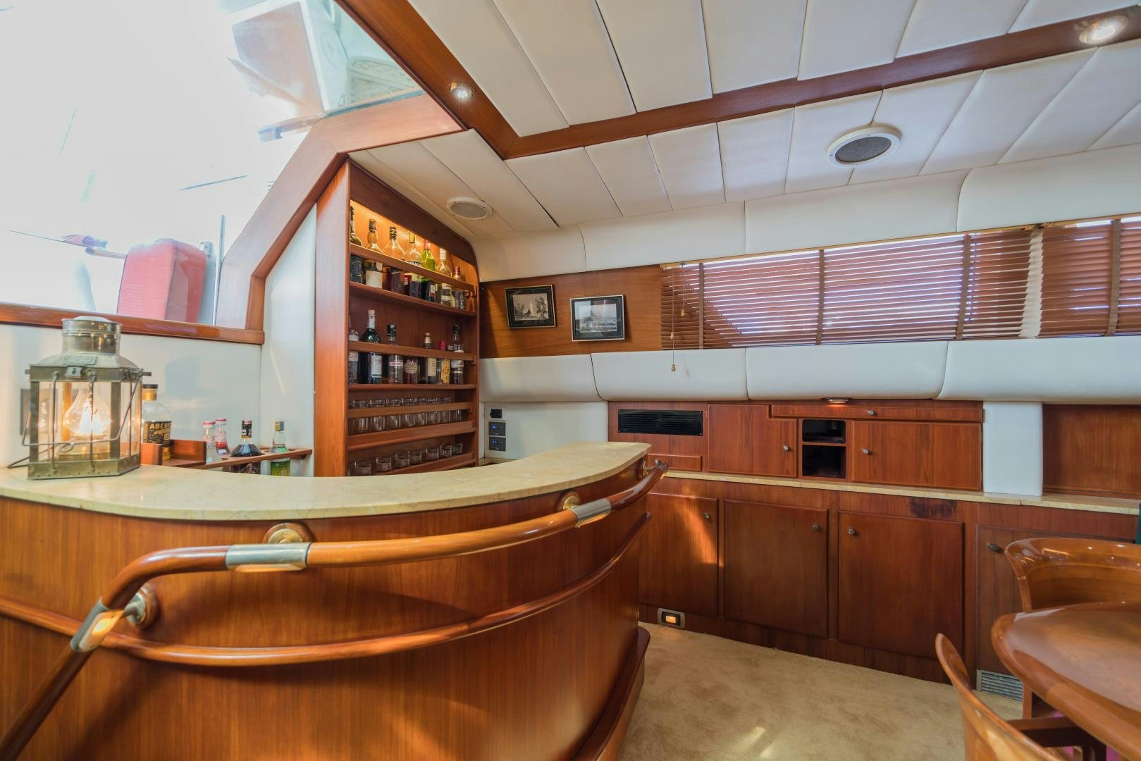 a kitchen with wooden cabinets aboard TARONGA Yacht for Sale