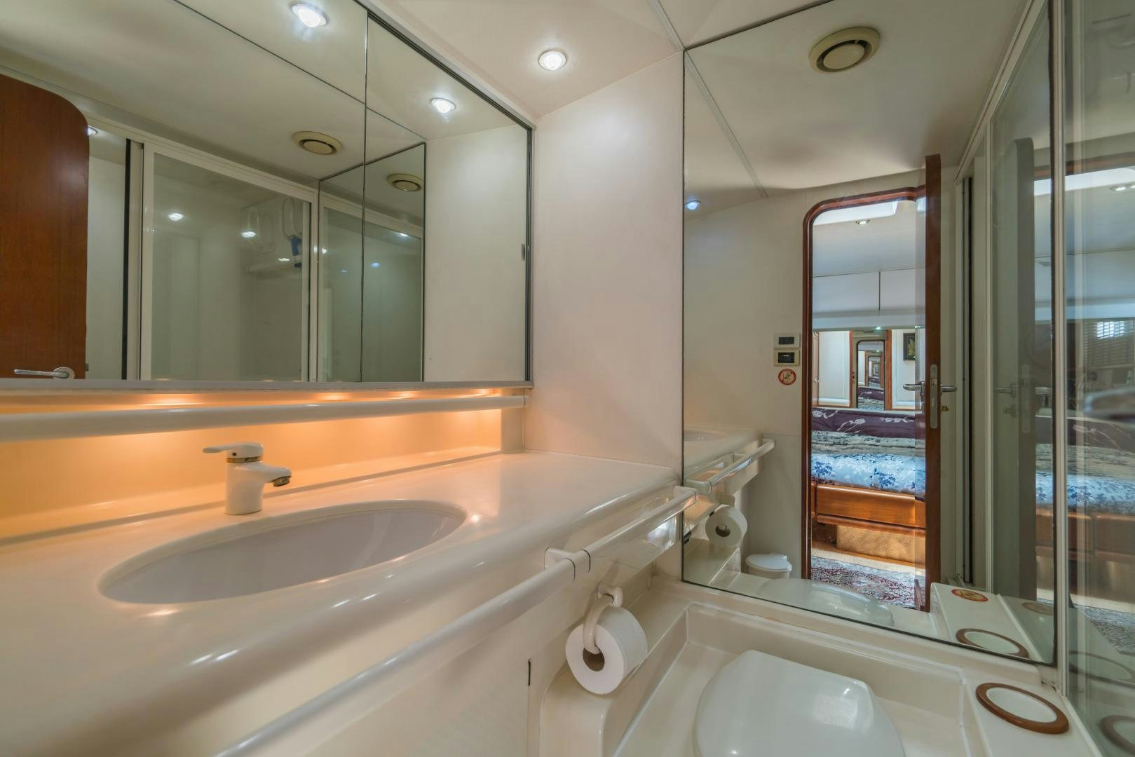 a bathroom with a large mirror aboard TARONGA Yacht for Sale