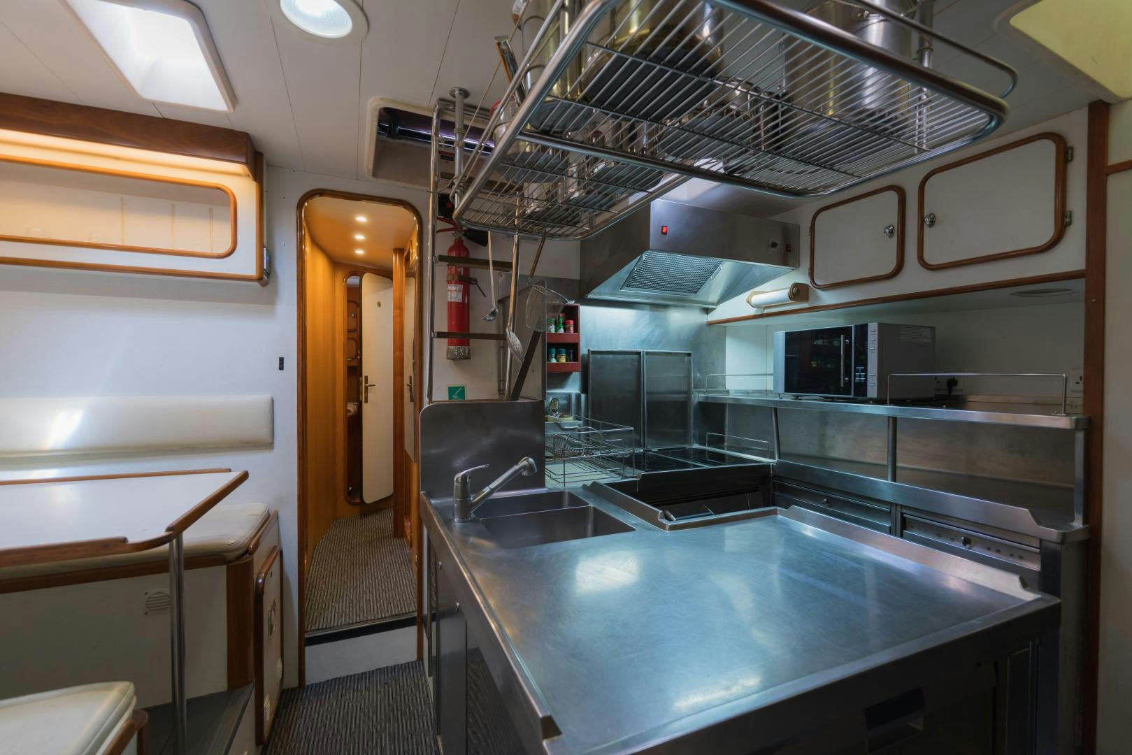 a kitchen with stainless steel appliances aboard TARONGA Yacht for Sale