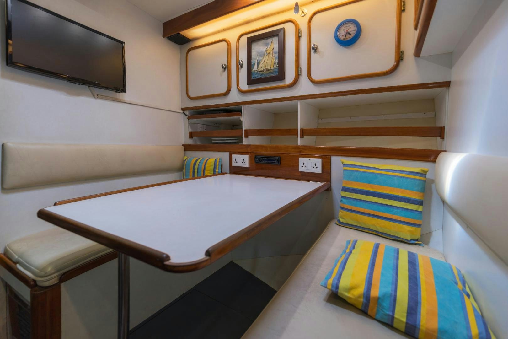 a room with a table and chairs aboard TARONGA Yacht for Sale