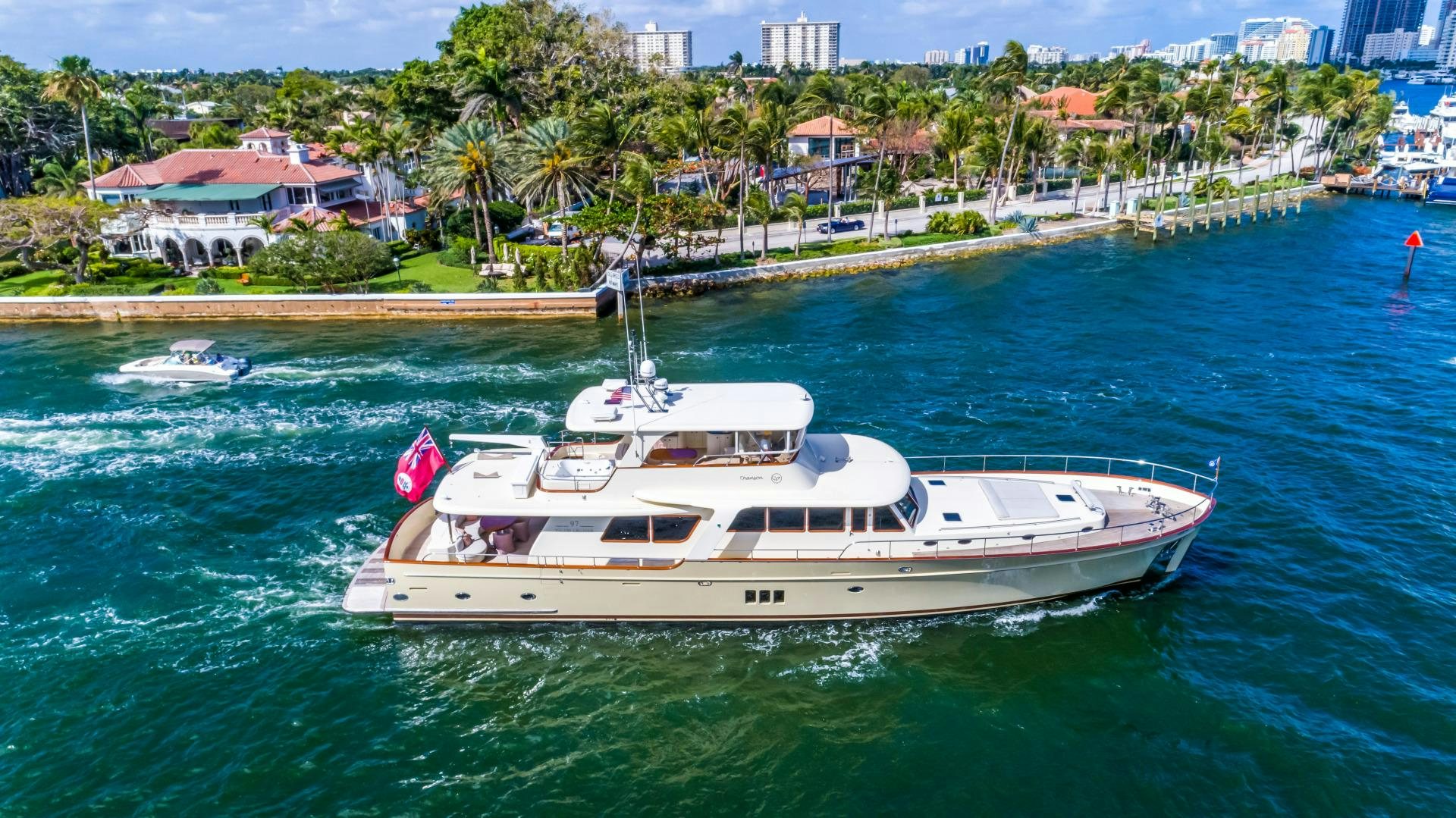 a white boat on the water aboard CHANSON II Yacht for Sale