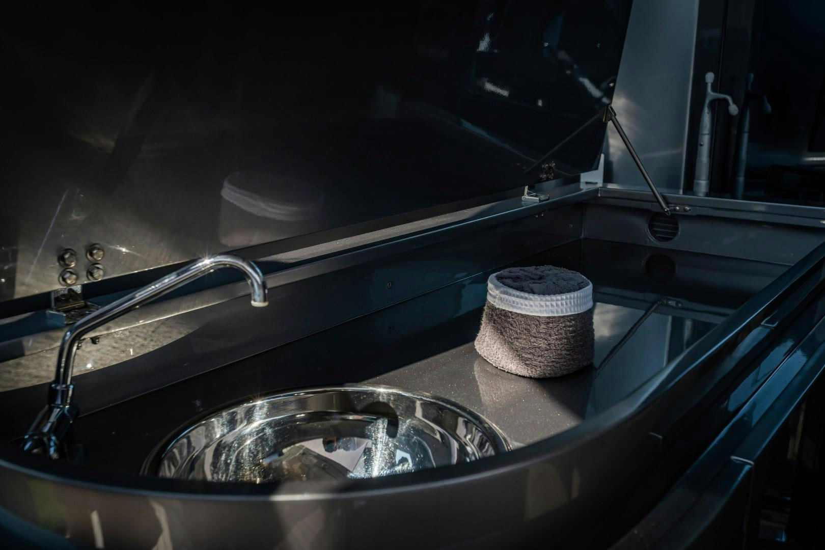 a sink with a soap dispenser aboard REVEIL Yacht for Sale