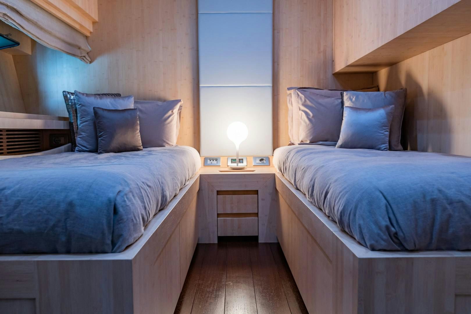a couple of beds in a room aboard REVEIL Yacht for Sale