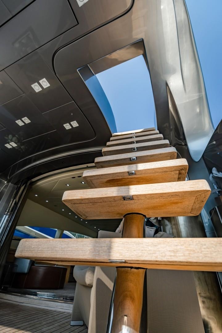 a wooden table with a screen aboard REVEIL Yacht for Sale