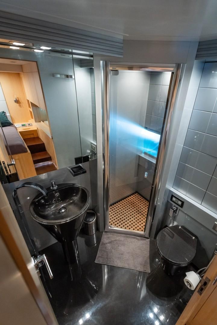 a bathroom with a glass shower aboard REVEIL Yacht for Sale