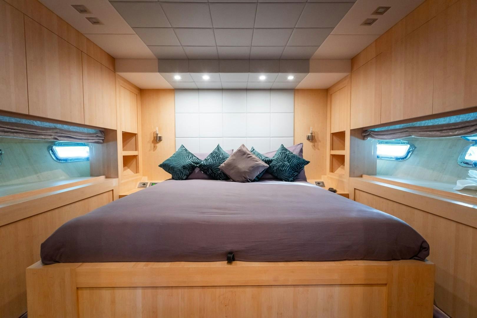a bed in a room aboard REVEIL Yacht for Sale