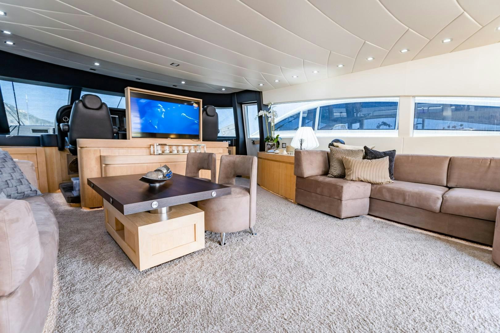 a living room with a large tv aboard REVEIL Yacht for Sale