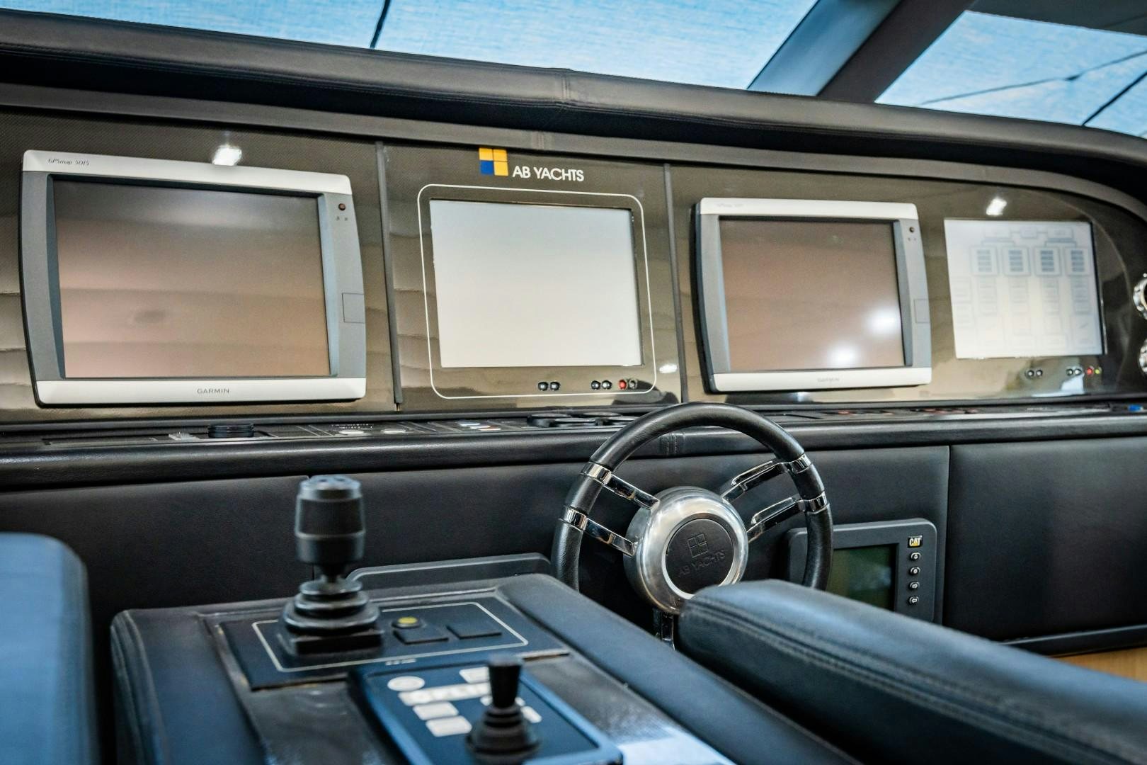 a car with a screen and a speaker on the dashboard aboard REVEIL Yacht for Sale
