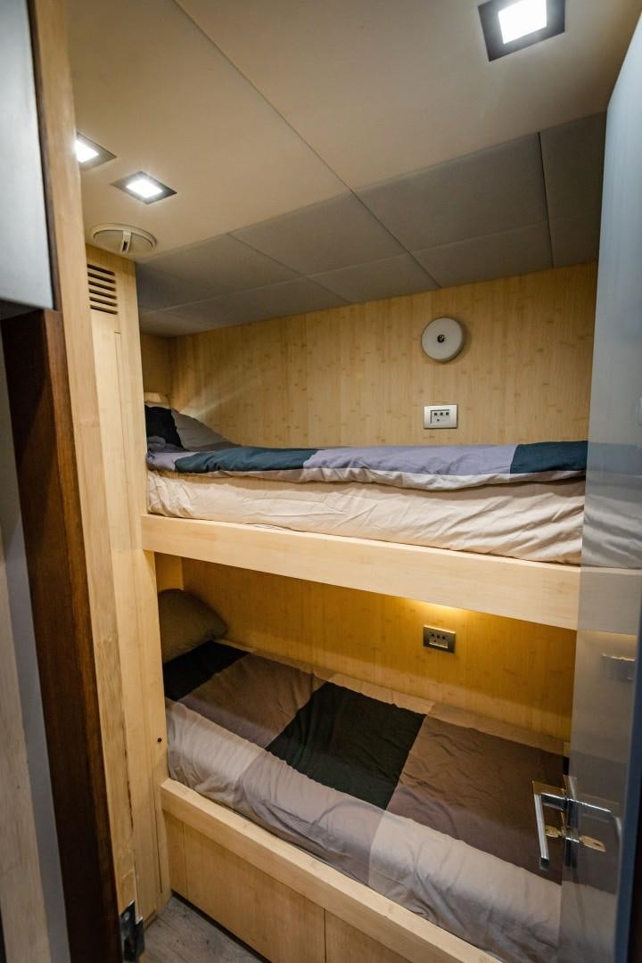 bunk beds in a room aboard REVEIL Yacht for Sale