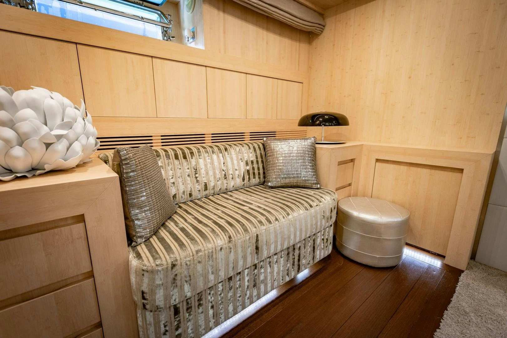 a room with a bed and a table aboard REVEIL Yacht for Sale