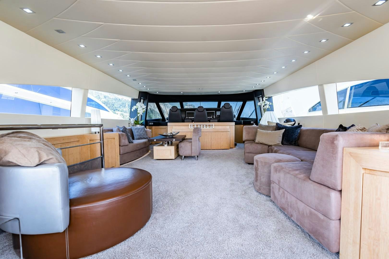 a living room with a large screen aboard REVEIL Yacht for Sale