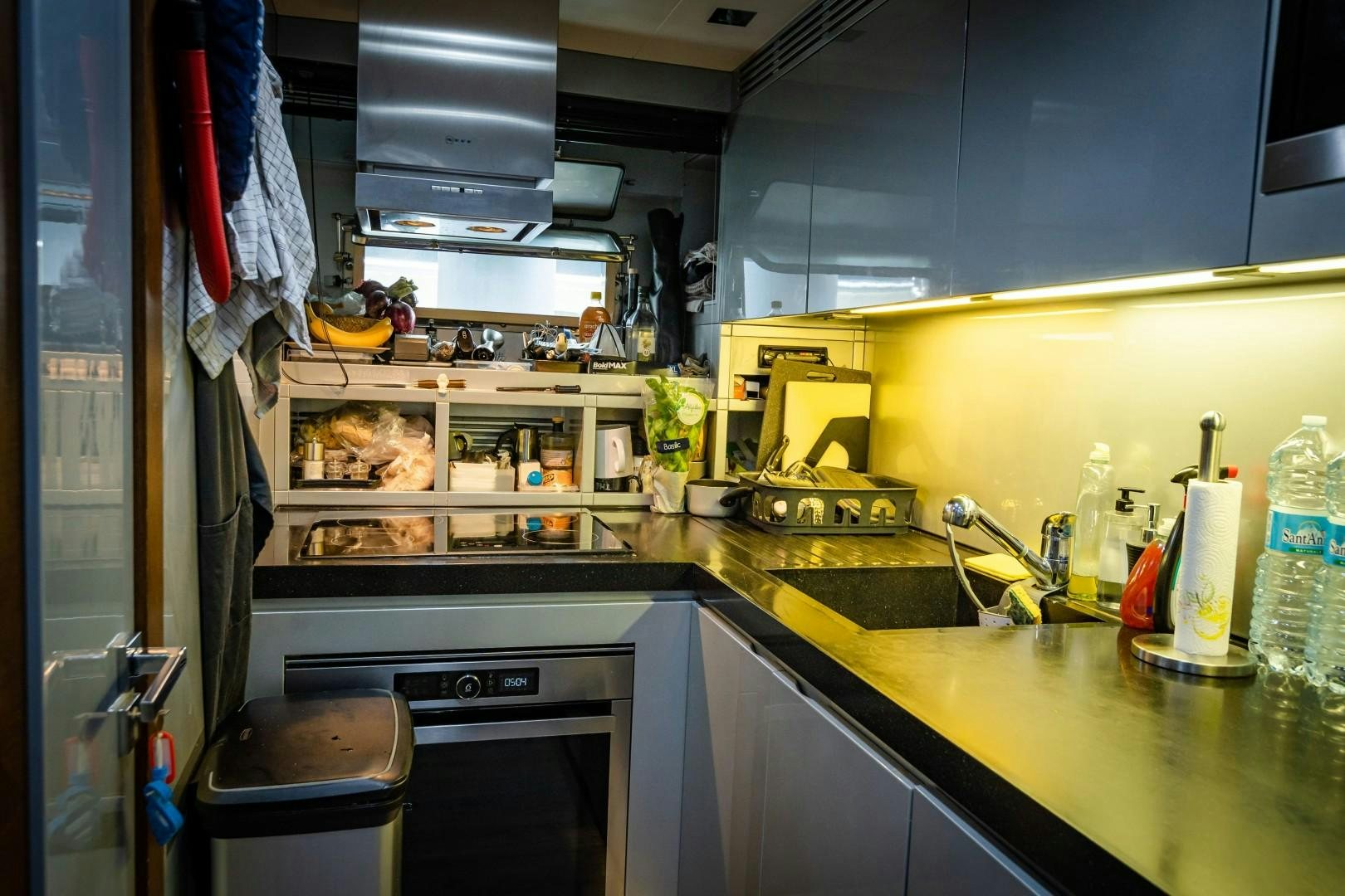 a kitchen with a stove and sink aboard REVEIL Yacht for Sale